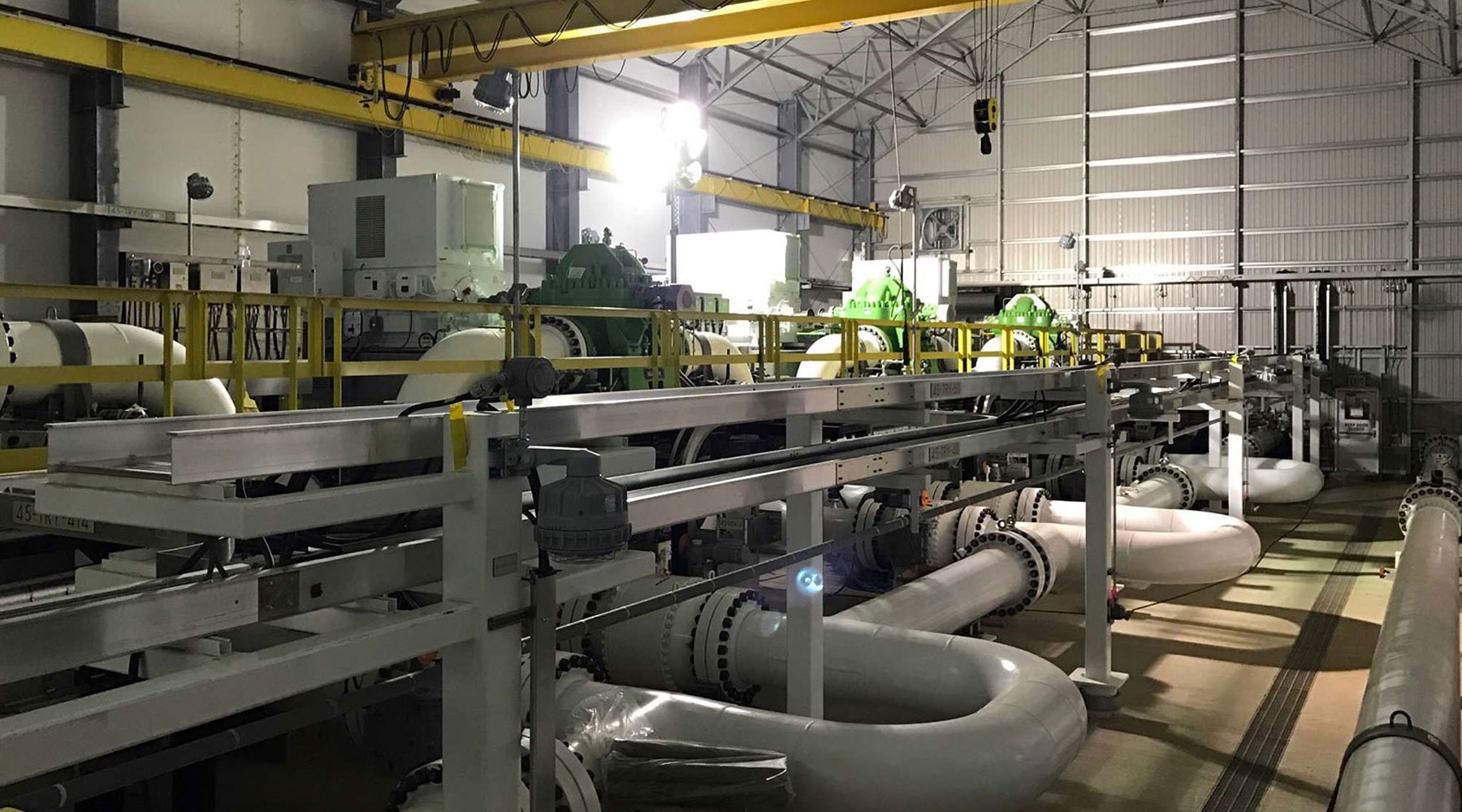 Picture of pipes, equipment and machinery inside of a workshop Picture of pipes, equipment and machinery inside of a workshop
