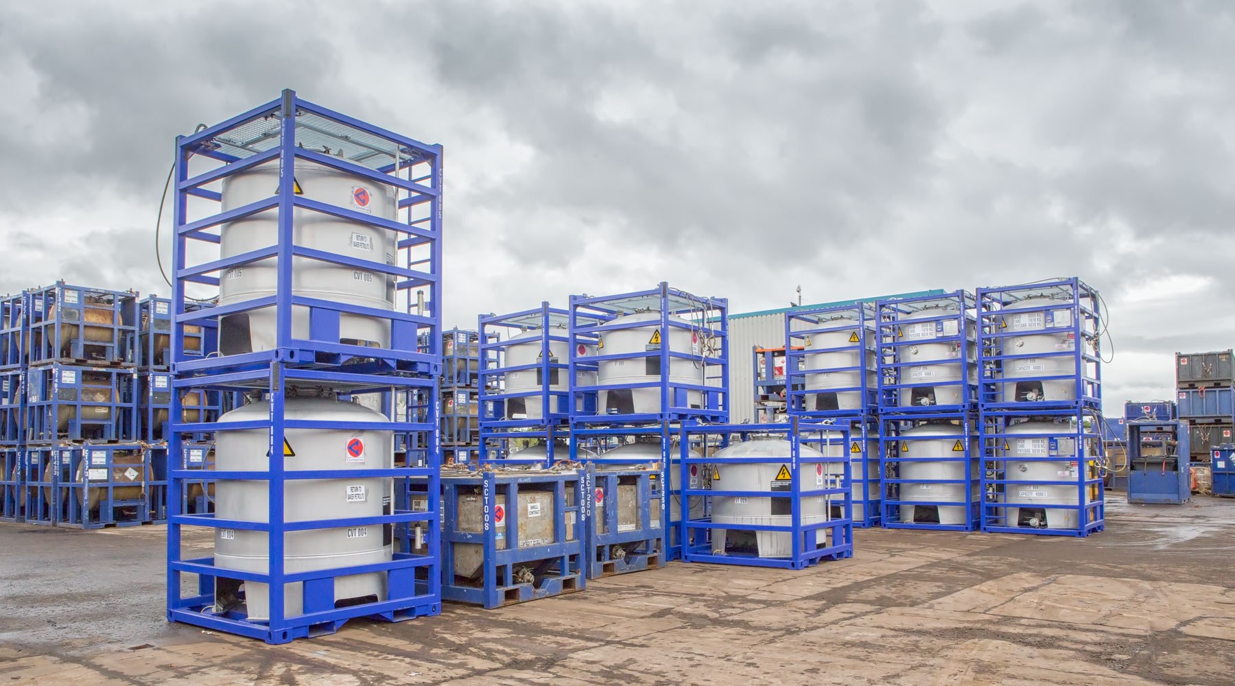 Containers encased in shipping baskets Containers encased in shipping baskets