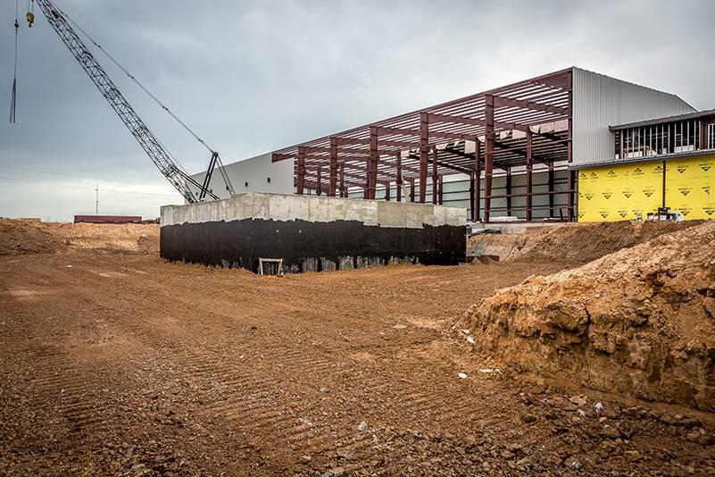 Image of a concrete structure being built outside of a building under construction