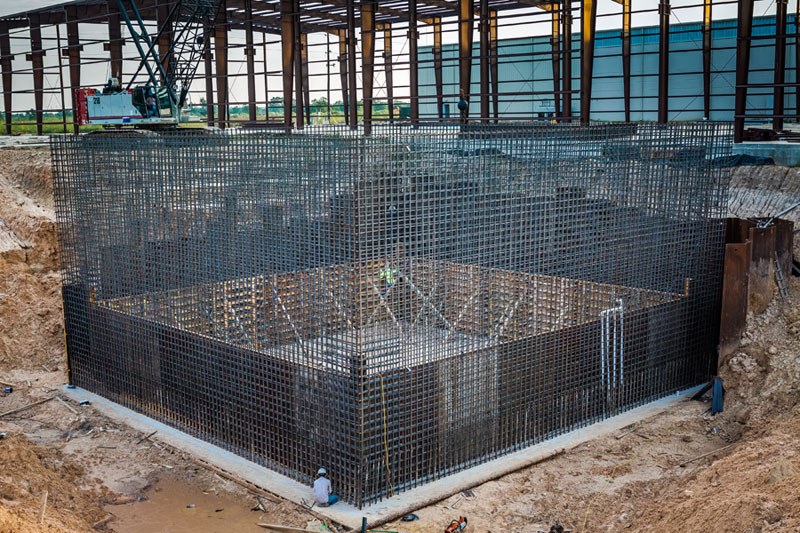 Image of a large square structure being built